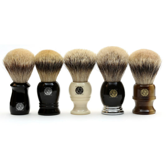 Five shaving brushes of different fibers displayed.