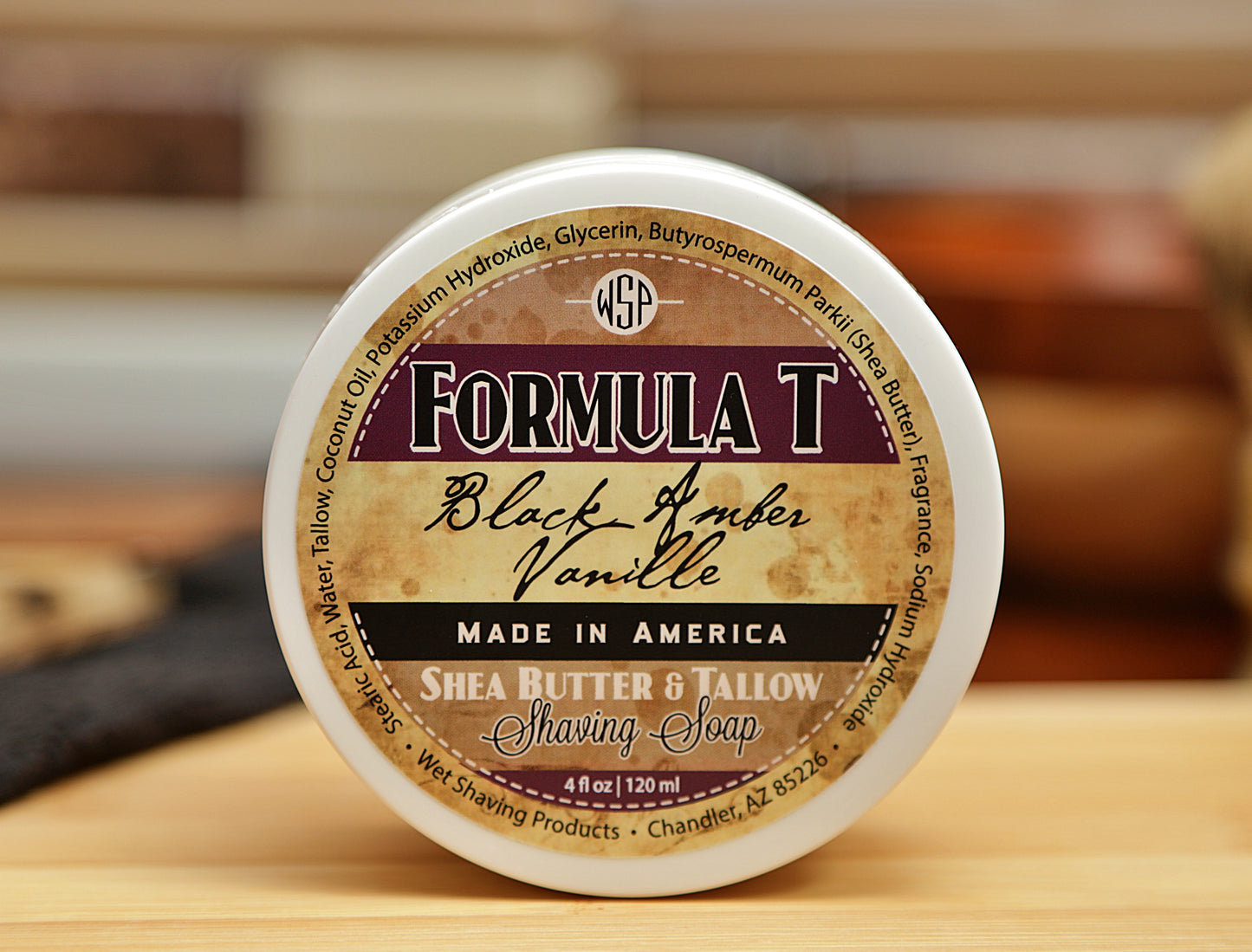 WSP small round container on table Black Amber Vanilla Formula T Shaving Soap