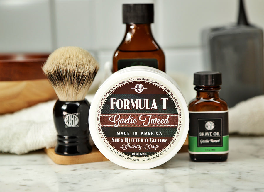 Shaving Set of Gaelic Tweed shave oil, rustic shaving soap, aftershave tonic and shaving brush all sitting on wooden board with white towel