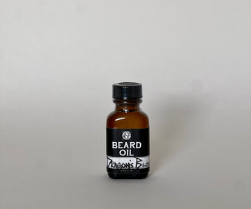 small brown jar of beard oil