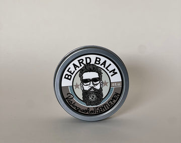 small round container of beard balm