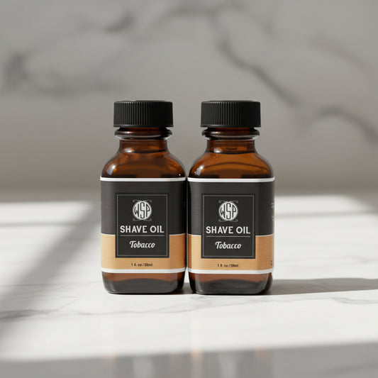 Two bottles of WSP Tobacco Shave Oil on a white background