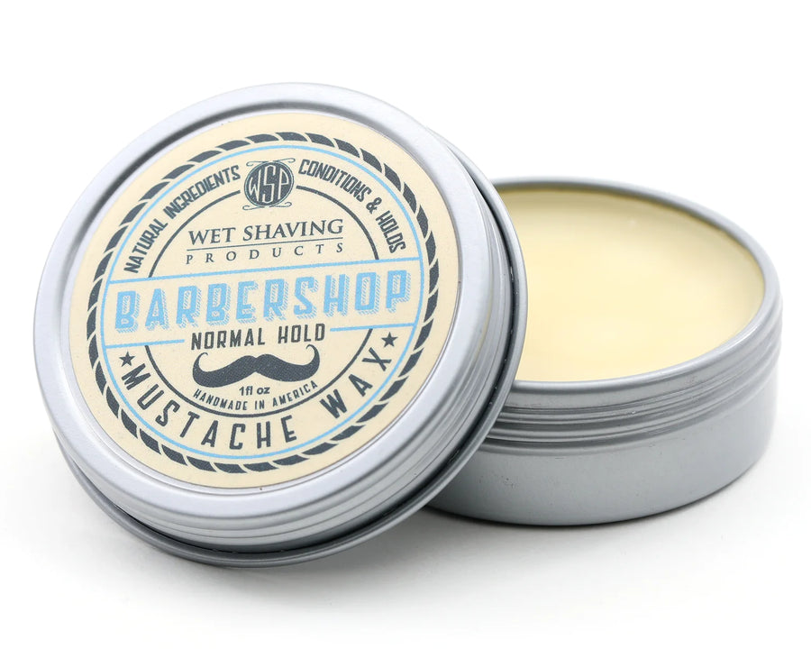 Open Normal Hold Mustache Wax tin with 'Barbershop' scent, lid leaning against the base.