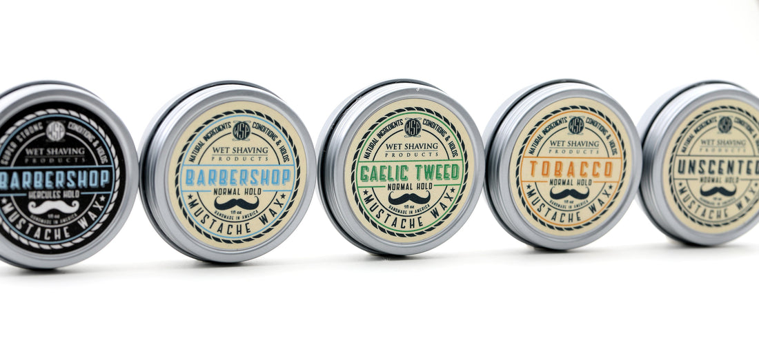 Assorted mustache wax tins on display.