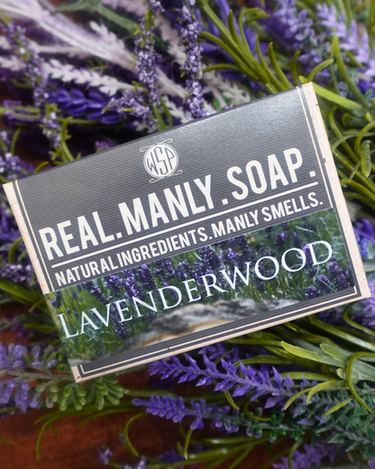 Real Manly Soap bar with lavender wood scent on a background of lavender flowers