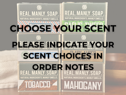set of 6 boxes of WSP Manly Soaps on a table with instructions on how to choose and order your scent.