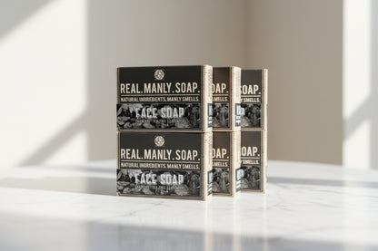 Real Manly Soap packaging on a marble surface with a blurred background