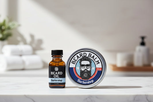 Beard oil bottle and balm tin with 'Barbershop' branding on a white background