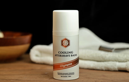 Small white bottle on table WSP Cooling Aftershave Balm in Olympus scent