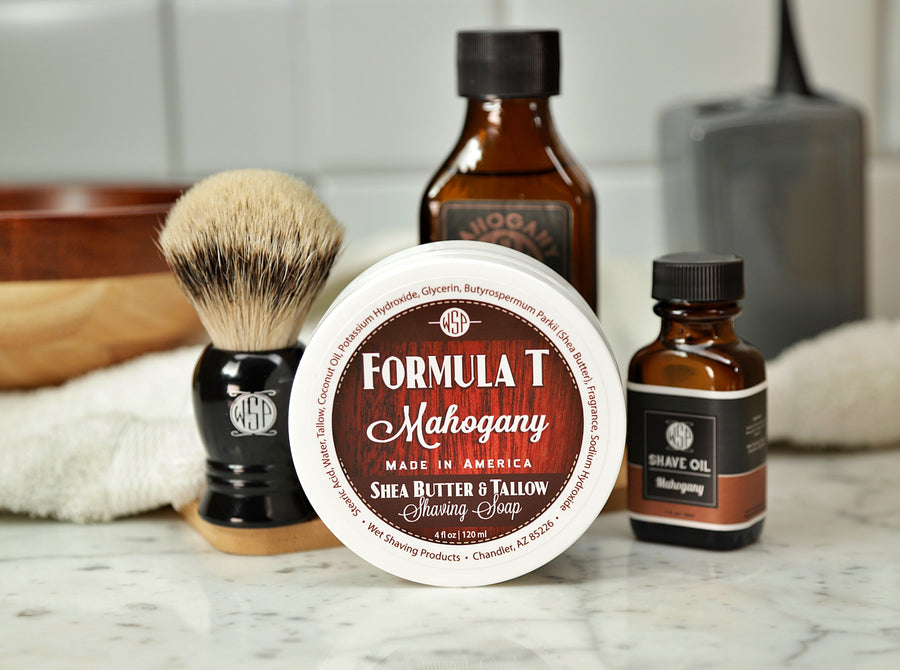 Shaving Set of Mahogany shave oil, Formula T shaving soap, aftershave tonic and shaving brush all sitting on wooden board with white towel