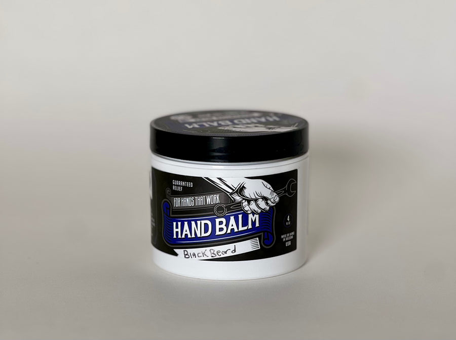 small black and white jar of hand balm