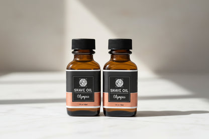 Two bottles of WSP Shave Oil Olympus on a white background
