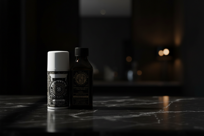 Two bottles on a dark marble surface with a blurred background