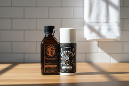 Two bottles of Tobacco Aftershave products on a white background