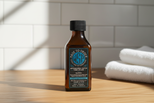 Cooling Aftershave Resting on a clean, warm oak wooden bathroom counter, bright natural morning light streaming from the side, out of focus background of classic white subway tiles and a folded white cotton towel, clean, timeless, masculine grooming atmosphere, photorealistic, sharp focus on the product.