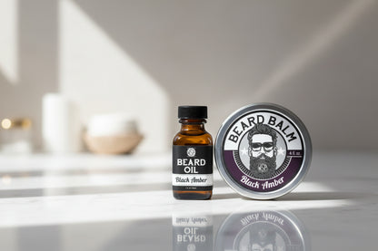 Beard oil bottle and balm tin with 'Black Amber' label on a white background