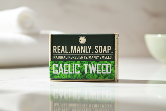 Bar of soap with 'Real. Manly Soap' branding on a white surface