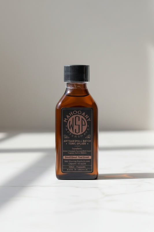 Bottle of Mahogany Aftershave with a black label on a white background