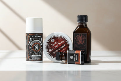 Collection of Mahogany shaving products on a wooden surface.