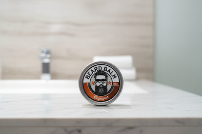 Beard balm container with label featuring a beard illustration on a textured surface.