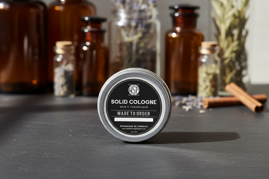 Solid cologne container with 'Made to Order' text on a dark surface with jars in the background