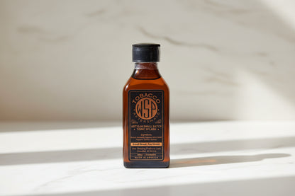Bottle of WSA Tobacco Aftershave on a marble countertop