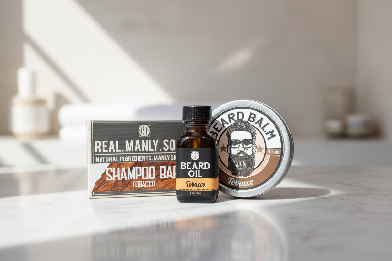 Beard care products including oil, balm, and shampoo bar on a white marble countertop