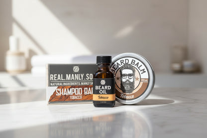 Beard care products including oil, balm, and shampoo bar on a white marble countertop