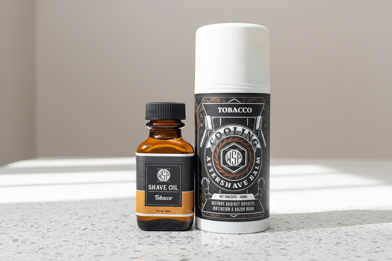 Two grooming products, a bottle of shave oil and a can of after-shave balm, on a countertop.
