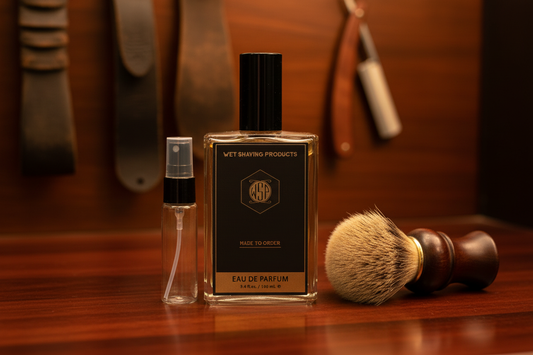 A vintage shaving brush and warm mahogany wood surfaces with leather accents, representing the classic, timeless scents of The Essentials collection by WSP.