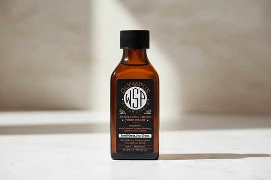 Olympus Aftershave bottle with black cap on a white background