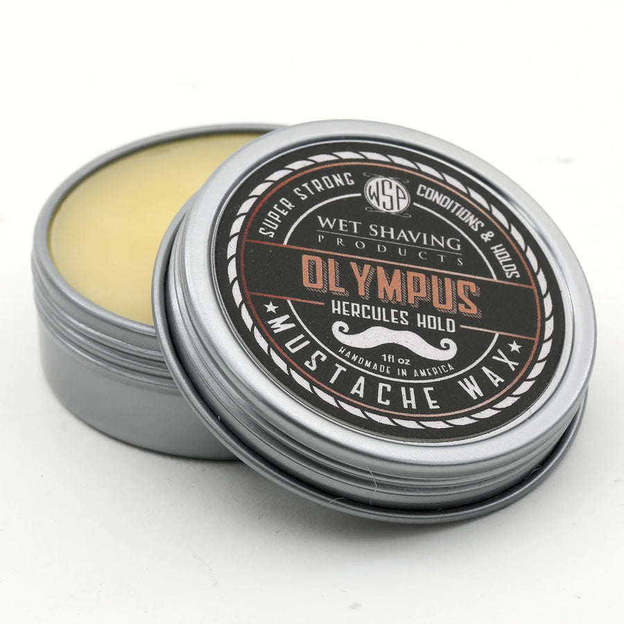 Open Hercules Hold Mustache Wax tin with 'Olympus' scent, lid leaning against the base.