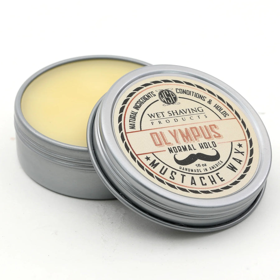 Open Normal Hold Mustache Wax tin with 'Olympus' scent, lid leaning against the base.