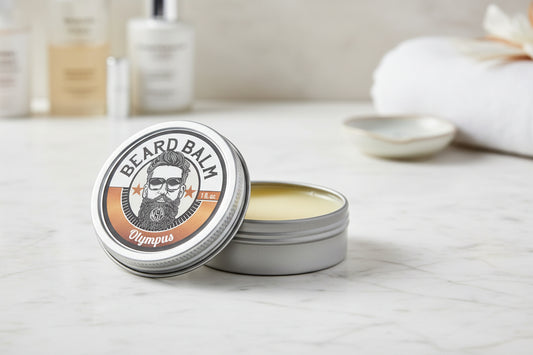 Beard balm container with label featuring a beard illustration and 'Olympus' branding.